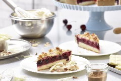 Cherry Cake with Butter Streusel served with cinnamon cream and chocolate curls
